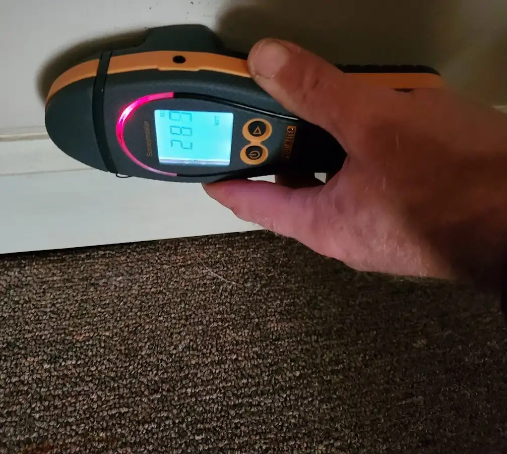 Moisture detection at baseboard during Storm Damage Restoration in Santa Monica